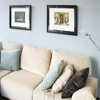 Living room with sofa and blue wall, interior design