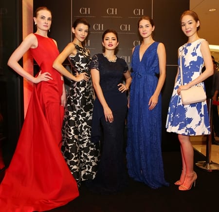 Fazura flanked by models dressed in CH Carolina Herrera SS2016